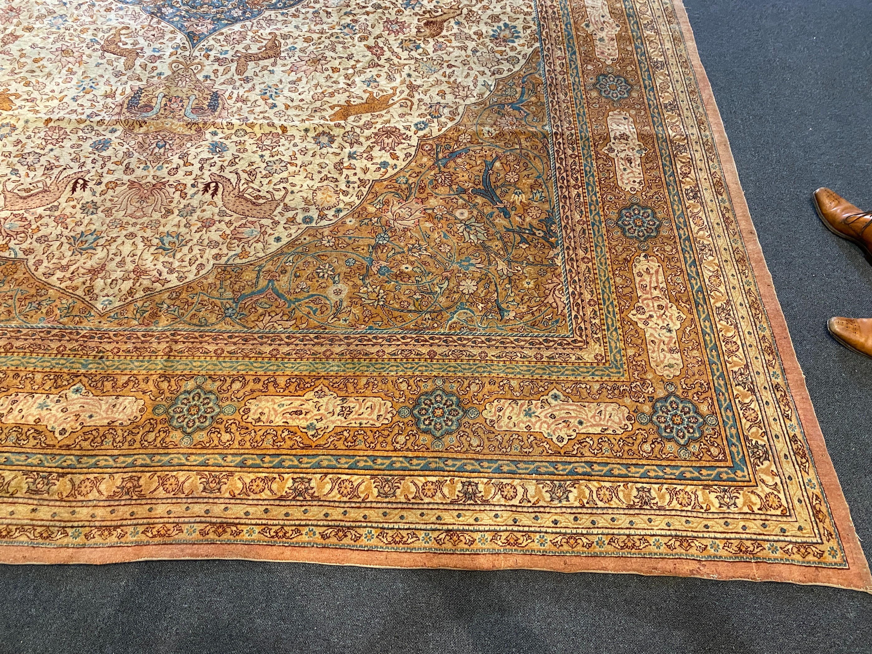 An early 20th century Tabriz ivory ground carpet, 528 x 348cm